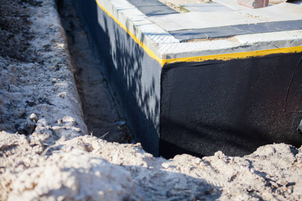 Professional Waterproofing technician working in Windsor, IL